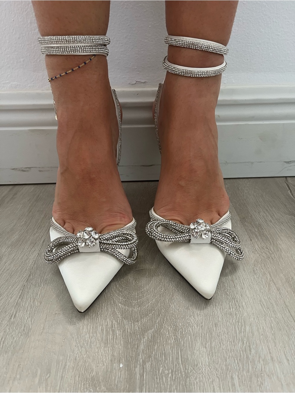 Elegant White Pointed Toe Ankle-Strap Heels with Crystal Bow